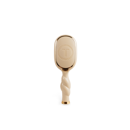 Mini Detangler Brush for Medium Hair in tan with twisted handle, gold accents, circular pattern, embossed "T". Sizes: mini.