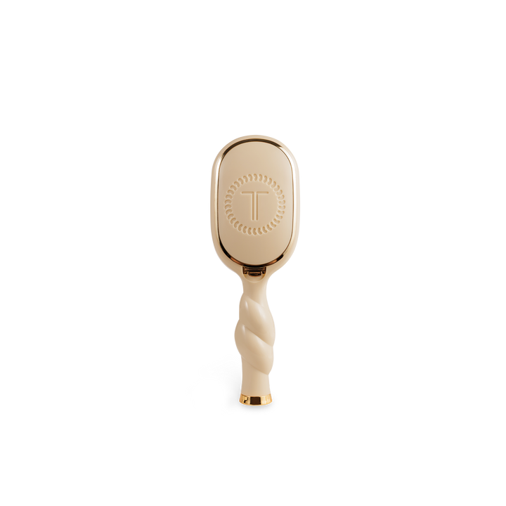 Mini Detangler Brush for Medium Hair in tan with twisted handle, gold accents, circular pattern, embossed "T". Sizes: mini.