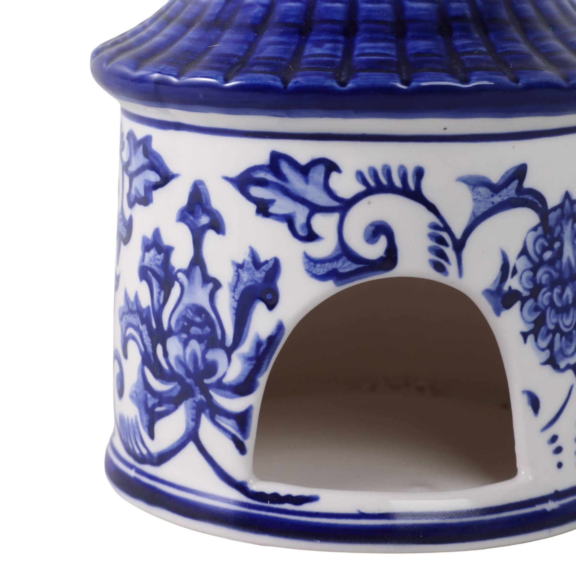 White/Blue ceramic Chinoiserie pagoda bird house, 8x5 in., with blue floral patterns, arched entry, pagoda roof.