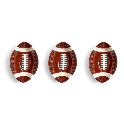 Set of three oval ceramic bowls designed to resemble American footballs, ideal for serving snacks on game day. Available sizes: small (6″), medium (8″), and large (10″).