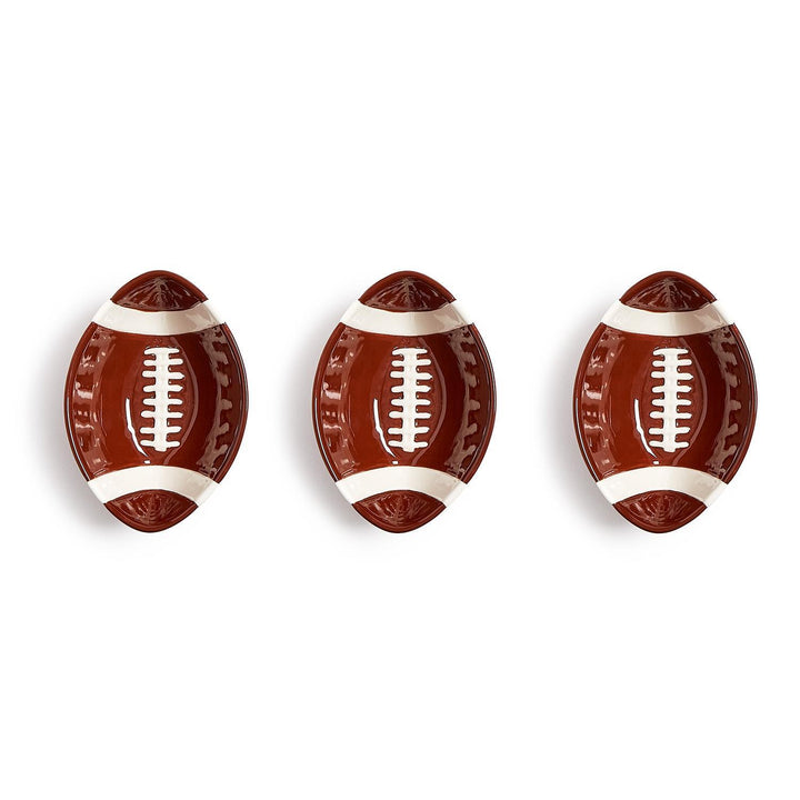 Set of three oval ceramic bowls designed to resemble American footballs, ideal for serving snacks on game day. Available sizes: small (6″), medium (8″), and large (10″).