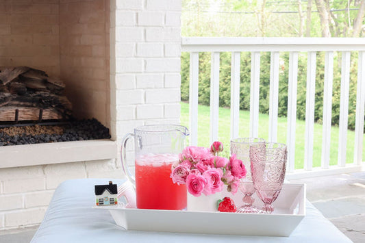 Pinstripes Melamine Tray holding a pitcher and glasses; tray available in 12"x16", 14"x18", and 16"x20" sizes.