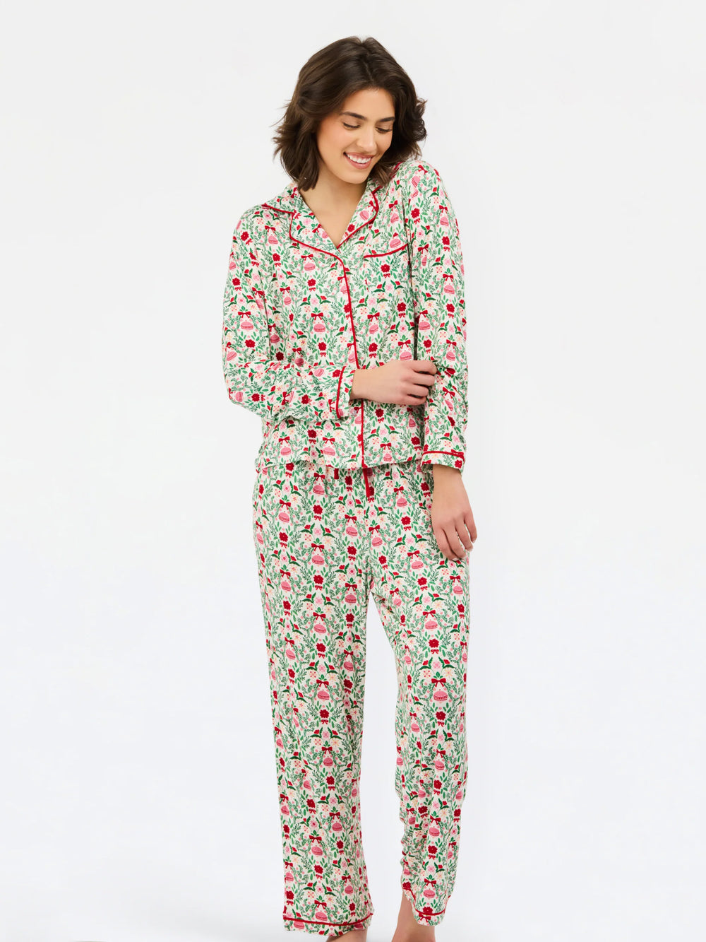 Charlotte Trimmed with Joy Pants Set featuring a long-sleeve button-down top and bottoms in a holiday floral and ornament print with red piping in a modal blend.