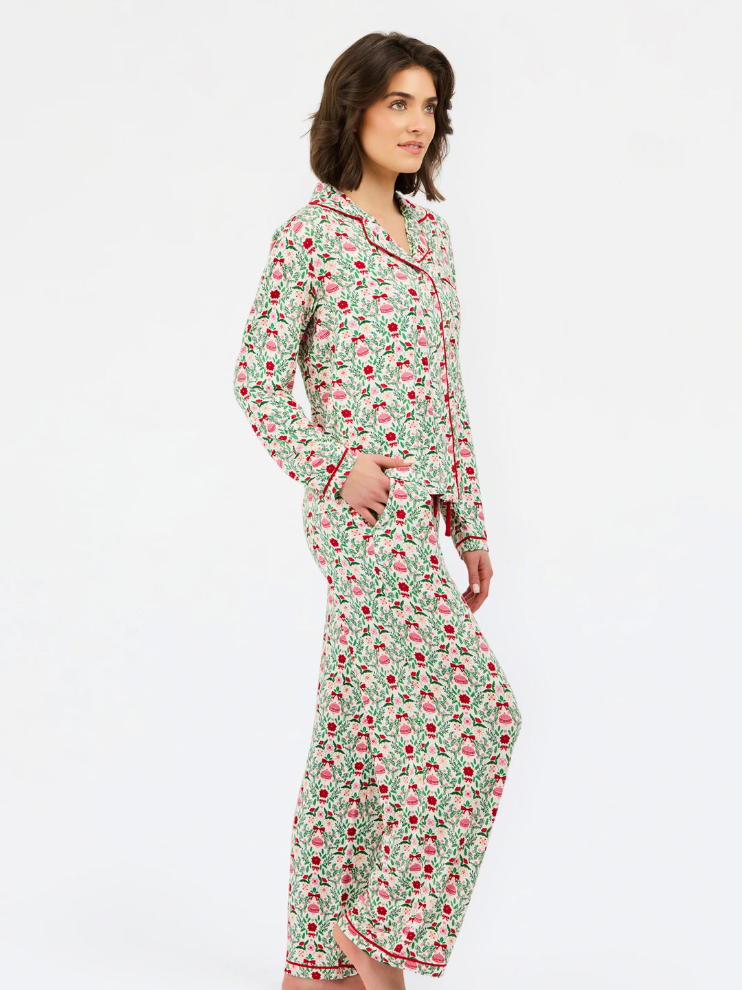 Charlotte Trimmed with Joy long-sleeved pajama shirt and matching pants in a green and red ornament print with red piping.