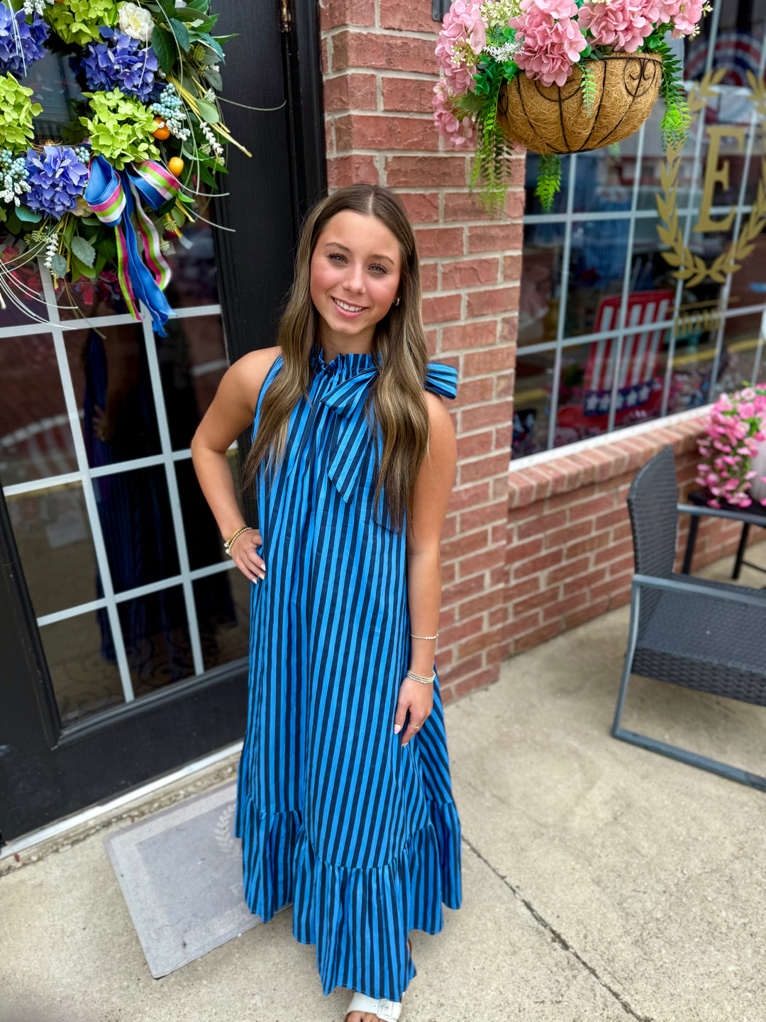 Navy Stripe Tie-Neck Midi Dress; available in sizes XS–XL. Features tie-neck detail and striped pattern.