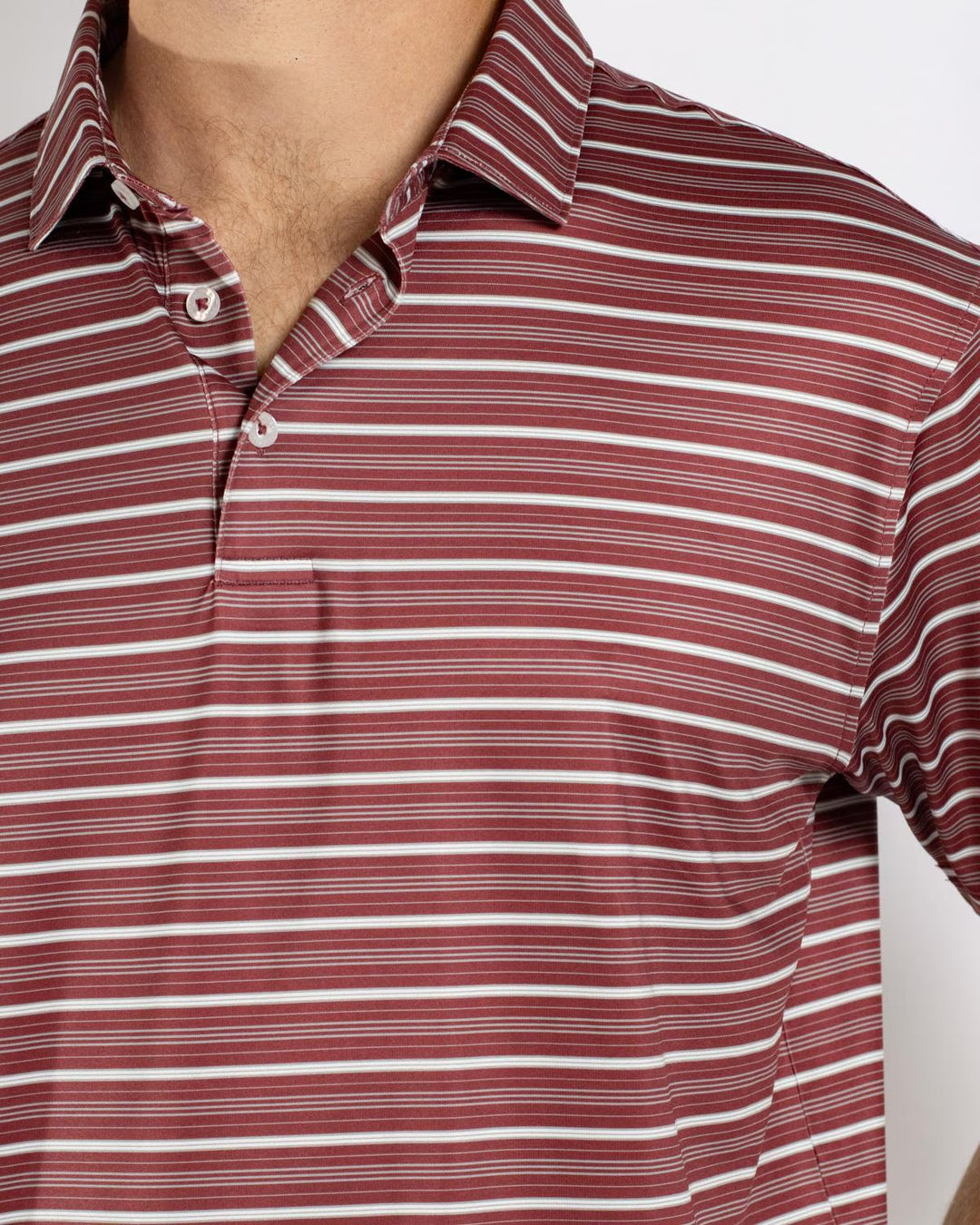 Men’s Maroon Sideline Striped Polo with partially undone top buttons. Available in sizes S-XXL.