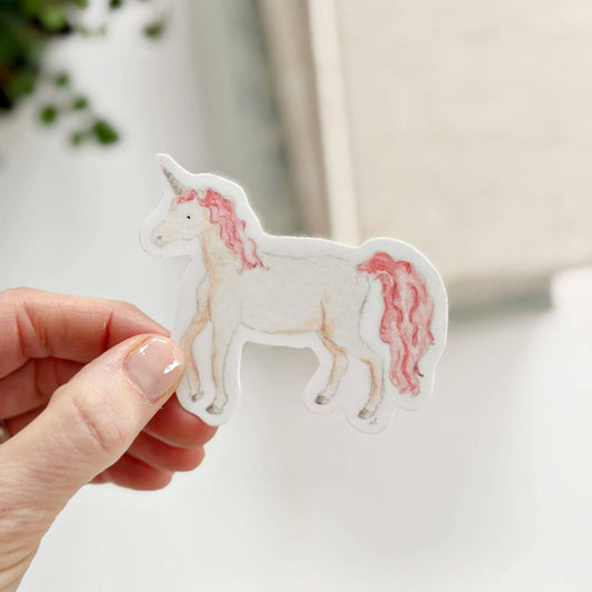 Unicorn sticker with white body, pink mane and tail in watercolor style. Available sizes: 2"x2", 3"x3".