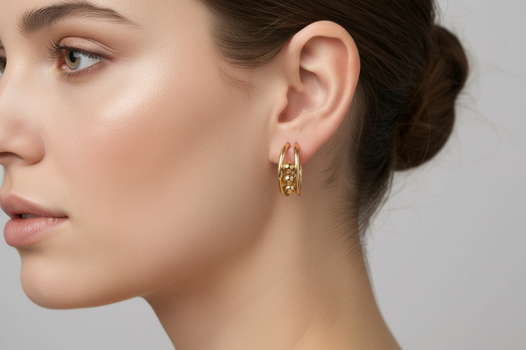 Hoop earrings with small decorative beads, available in 20mm, 30mm, and 40mm sizes.
