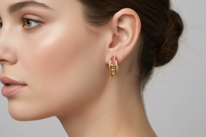 Hoop earrings with small decorative beads, available in 20mm, 30mm, and 40mm sizes.
