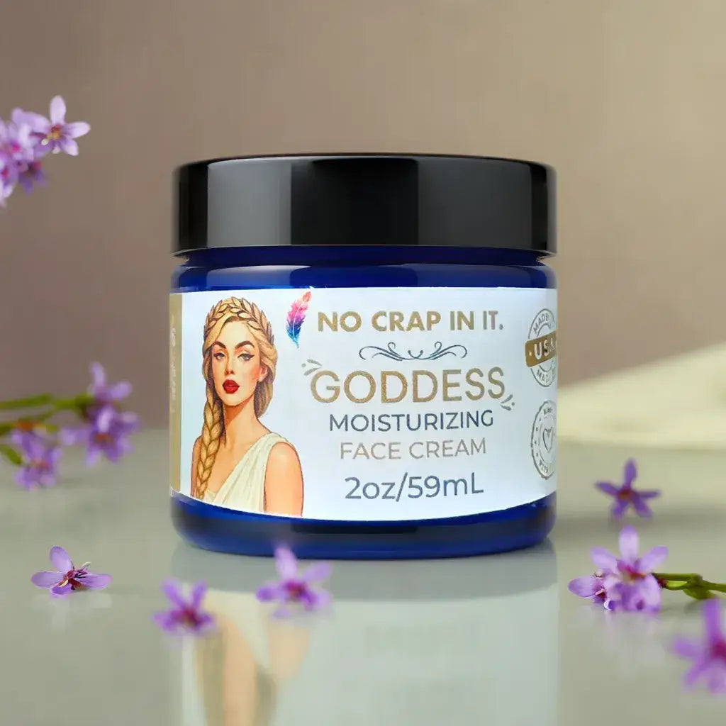 Blue jar of "Goddess Face Cream" with "No Crap In It" label; available in 50ml and 100ml sizes.