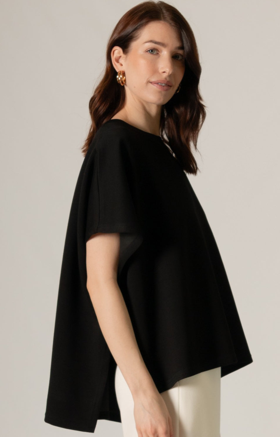 Loose-fitting black Butter Modal Side Slit Cape Top. Available in sizes S, M, L, XL.