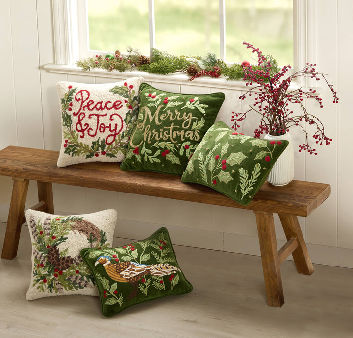 Five decorative Christmas pillows with festive designs and messages, including the Pheasant Embroidered Pillow. Available sizes: 18x18″, 20x20″, and lumbar.