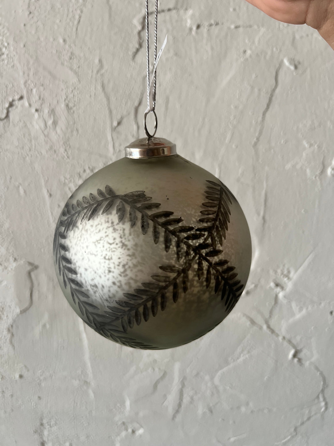 5″ round etched mercury glass ornament with fern leaf pattern.