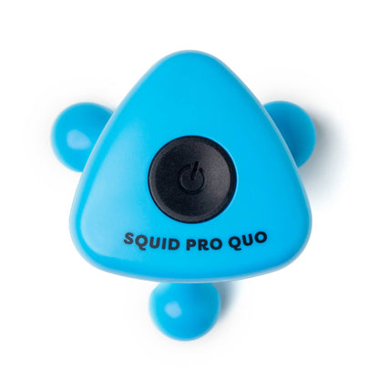 Blue, triangular rechargeable massager with three rounded legs, black power button, “SQUID PRO QUO” printed below. Sizes: S, M, L.