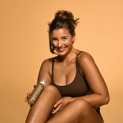 Bottle of Dark Self-Tanning Mousse shown; available in 100ml and 200ml sizes.