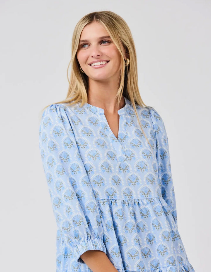 Cooper Botanical Blooms Dress: light blue, V-neck, floral print, tiered skirt. Available in sizes XS–XL.