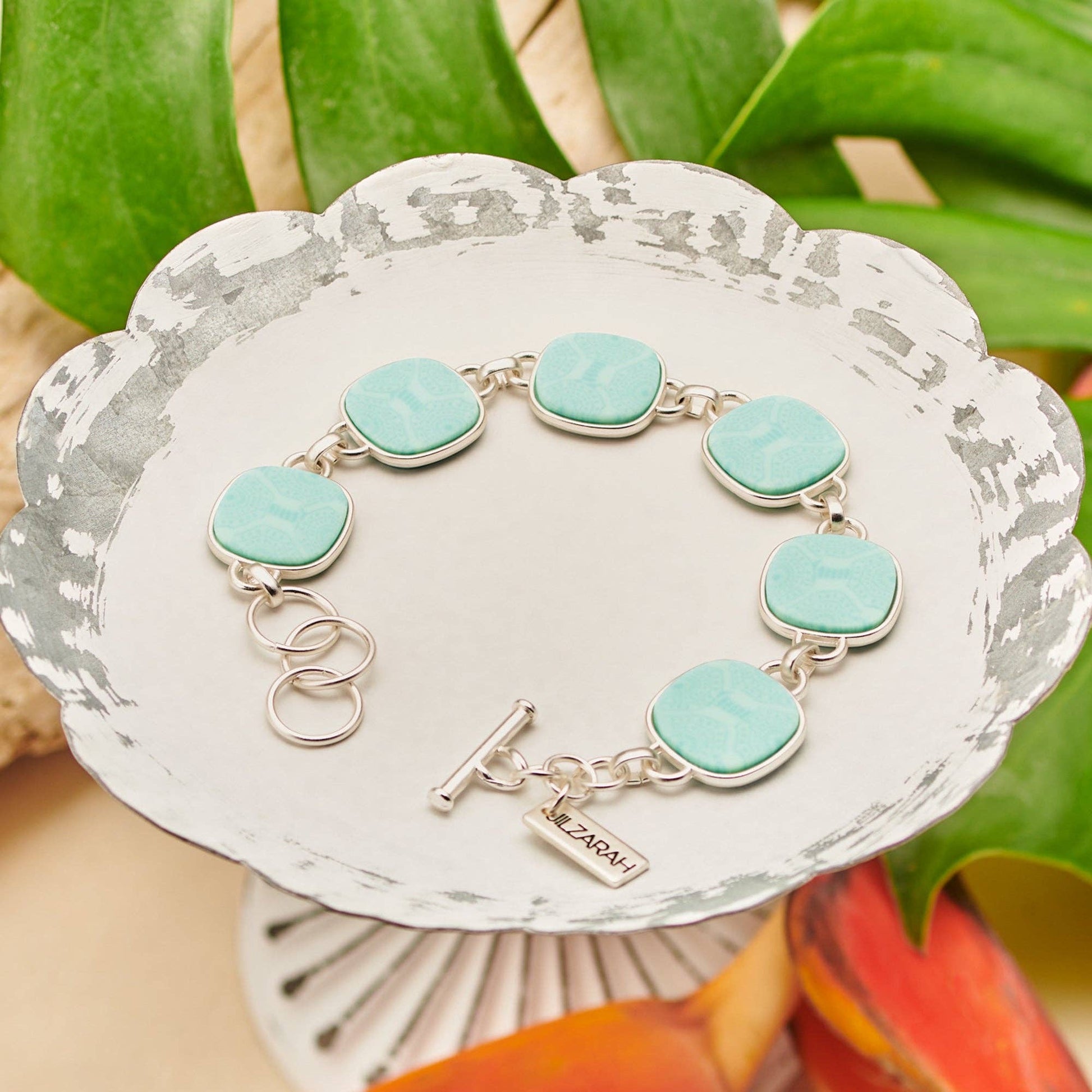 Palm Beach Reversible Coin Bracelet with turquoise square charms and hexagonal patterns, matte gold plating, name tag "SARAH." Sizes available: S, M, L.