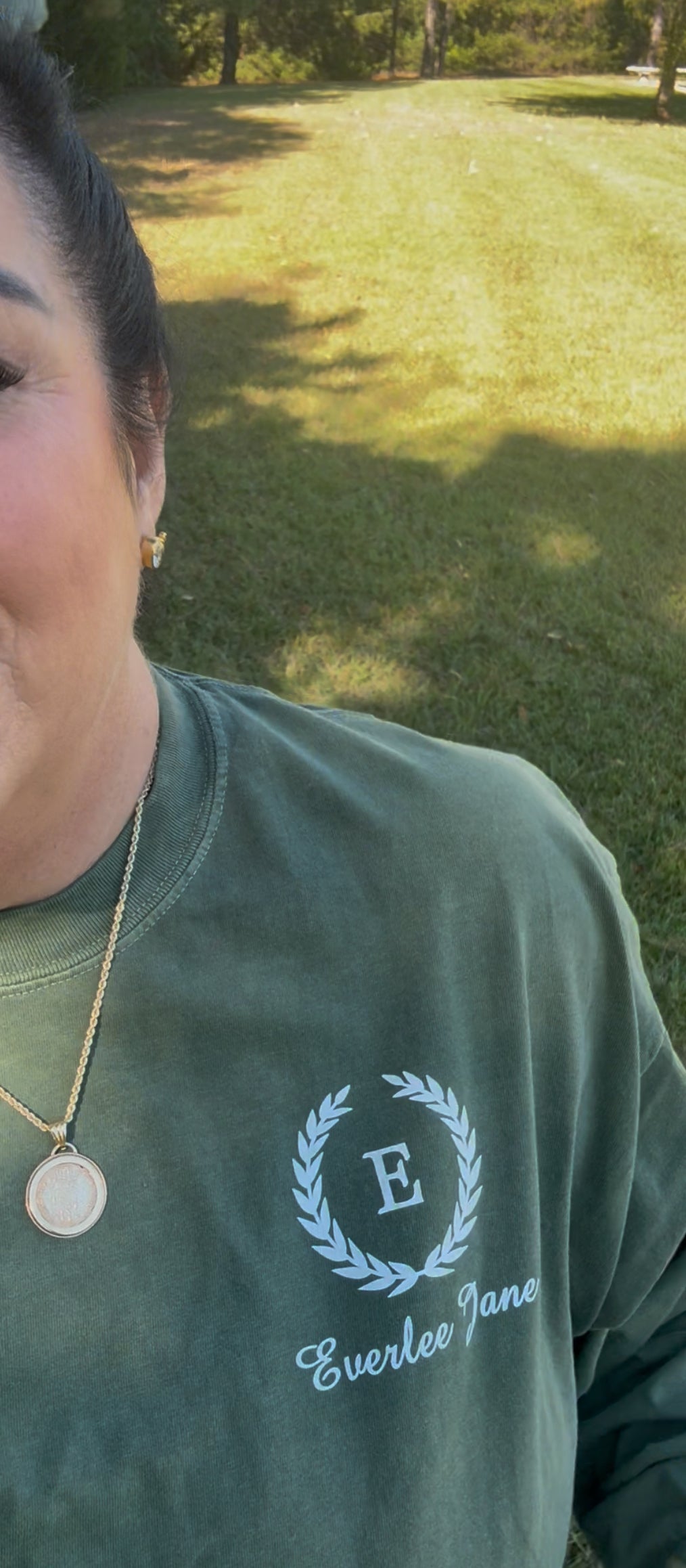 Everlee Jane Deep Green LS T-Shirt with white laurel and "E" logo. Available in sizes XS-XL.
