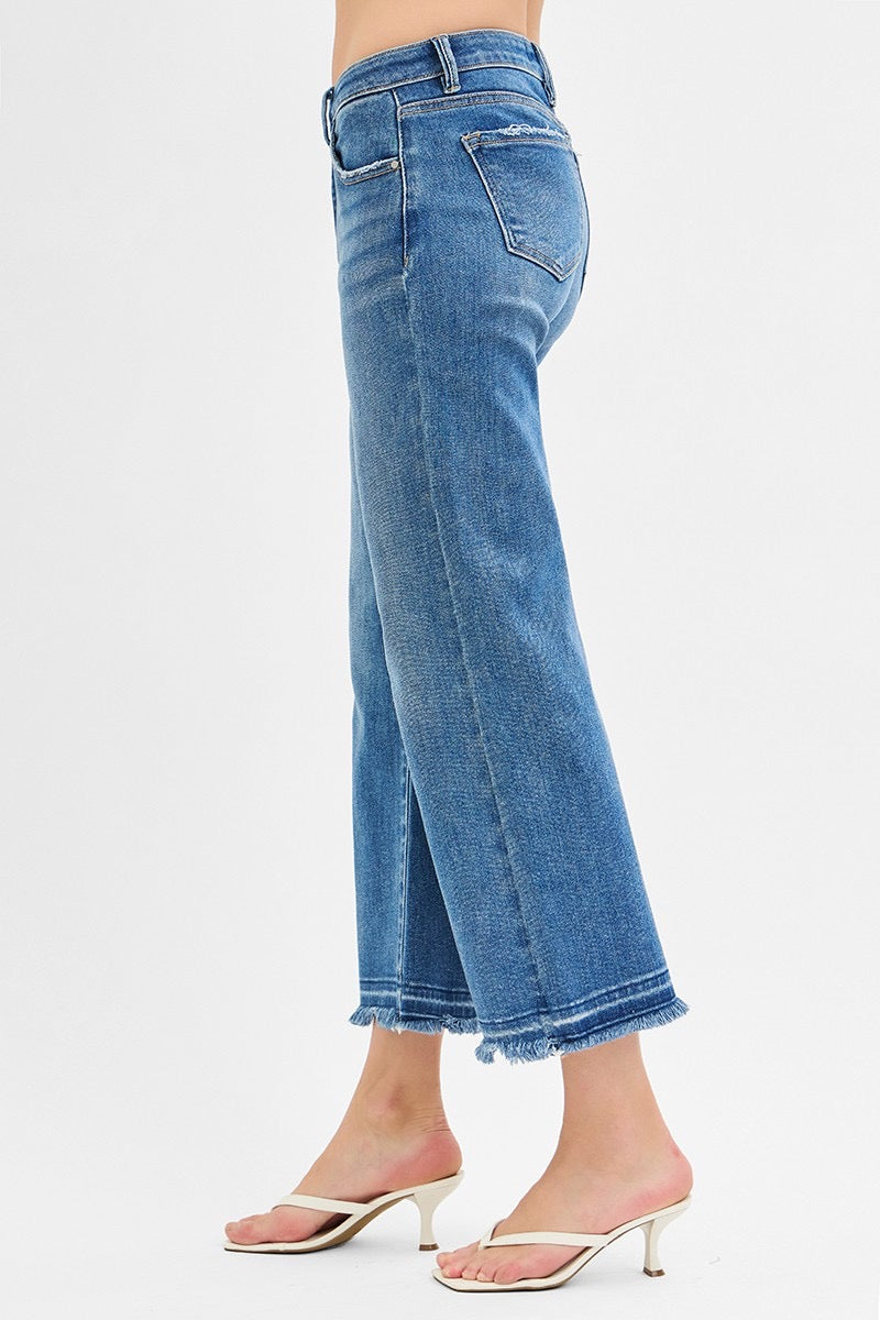 Mid Rise Crop Wide Jeans in medium wash with frayed hems; available in sizes 24–32.