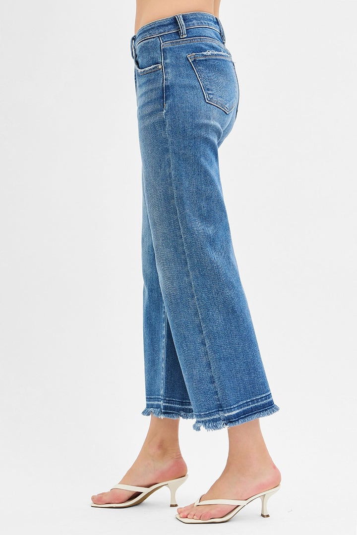 Mid Rise Crop Wide Jeans in medium wash with frayed hems; available in sizes 24–32.