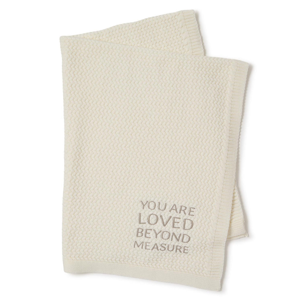 Cream textured knit baby blanket with "YOU ARE LOVED BEYOND MEASURE" in gray. Size: 30"x40".