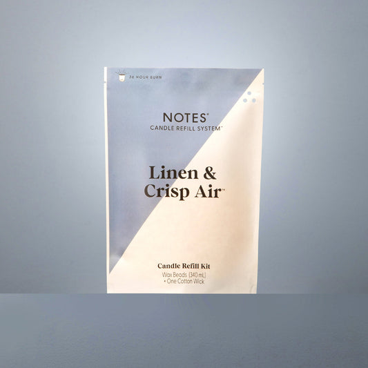 Notes Candle Refill in Linen & Crisp Air, beige/blue pack, natural wax beads, cotton wick, 24 hr burn; available in 7oz.