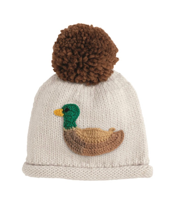 Cream chunky knit hat with large brown pom-pom, crocheted duck detail on front. Available in multiple sizes.