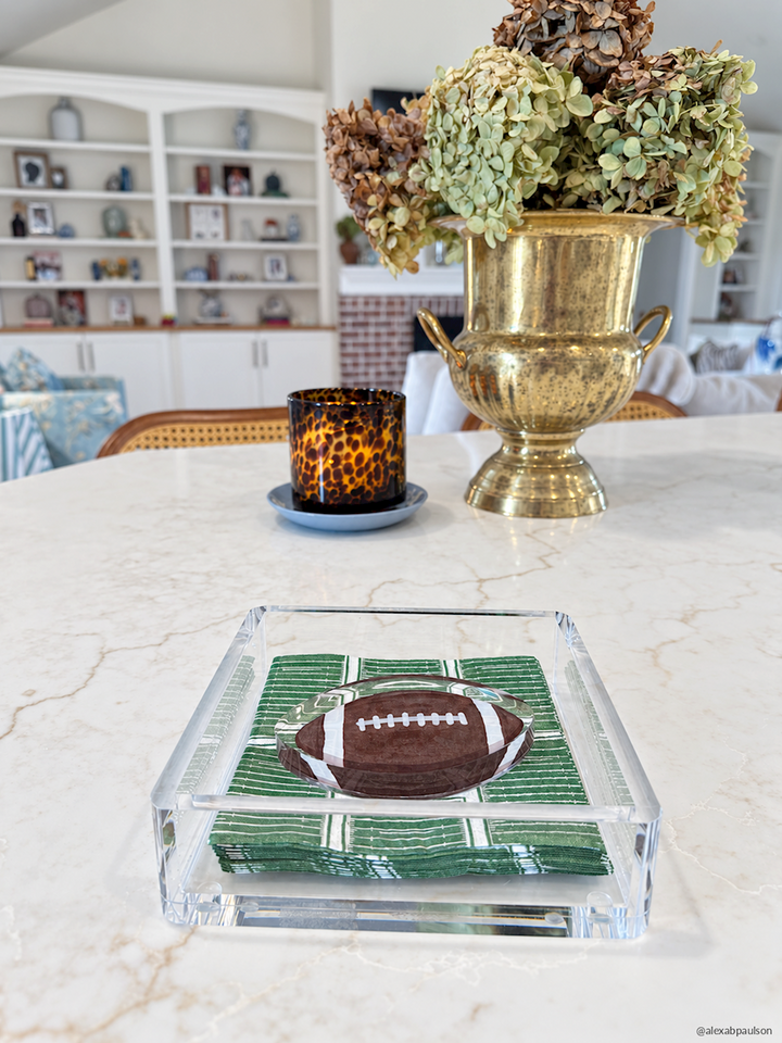 Football Napkin Weight Set displayed on a marble table; available in multiple sizes.