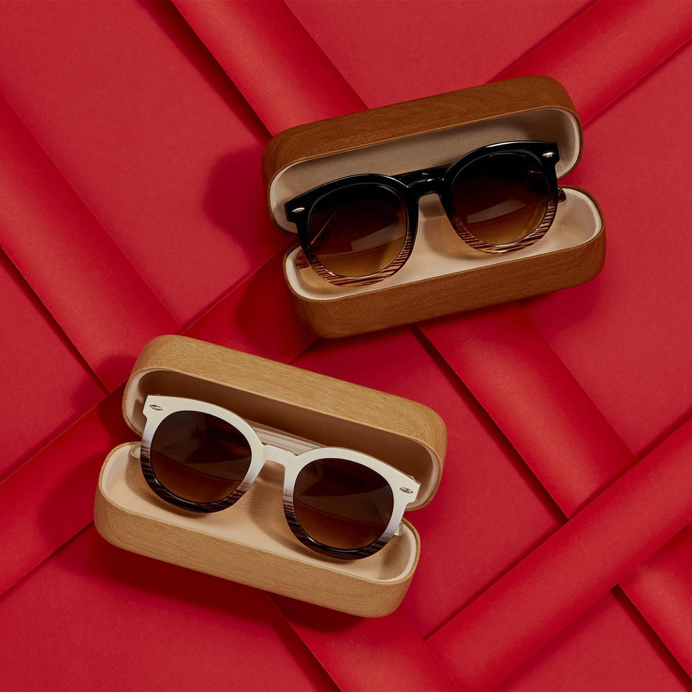 White and black Fade Frame Sunglasses in open cases. Available sizes: small, medium, large.
