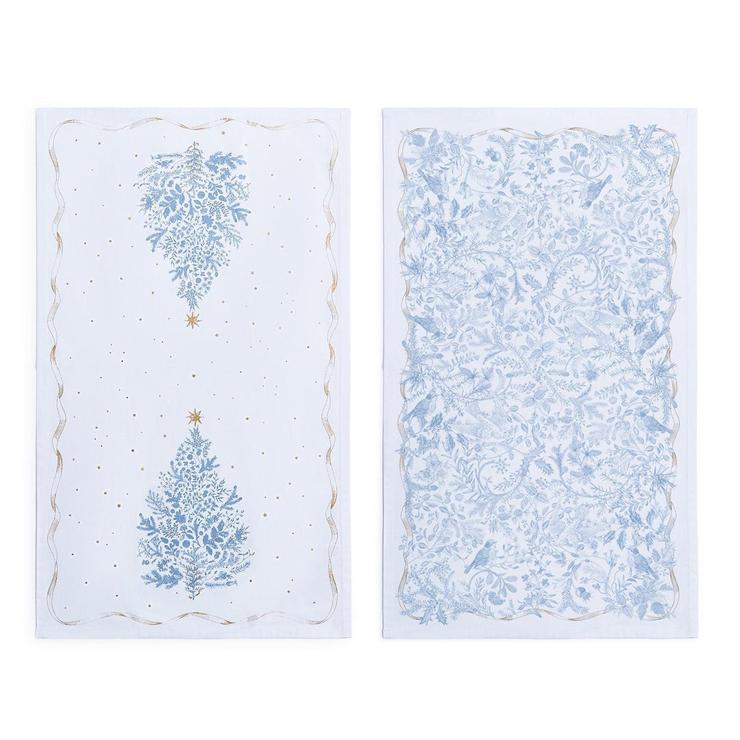 Gilded Cottage Dish Towels: one with two blue botanical trees and gold stars, the other with a dense blue botanical pattern and birds.