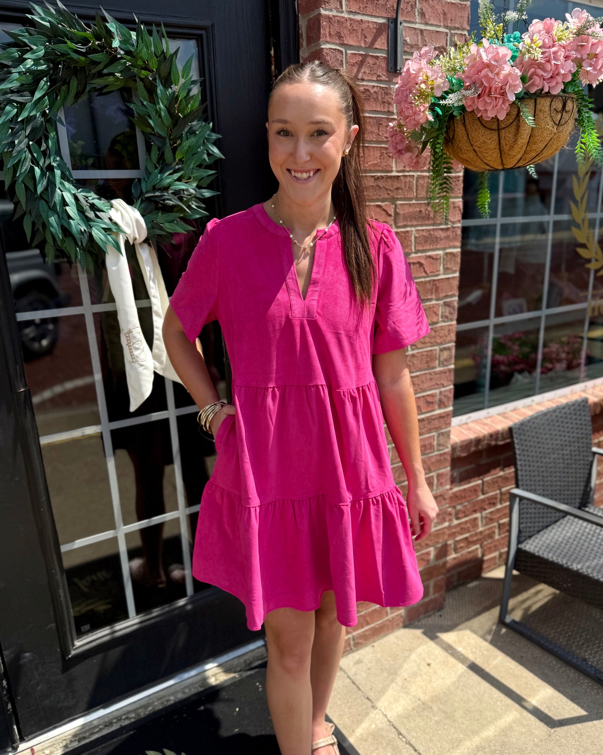 The Adelyn Pink Dress is a bright pink, feminine dress with playful tiers. Available in sizes XS-XL.