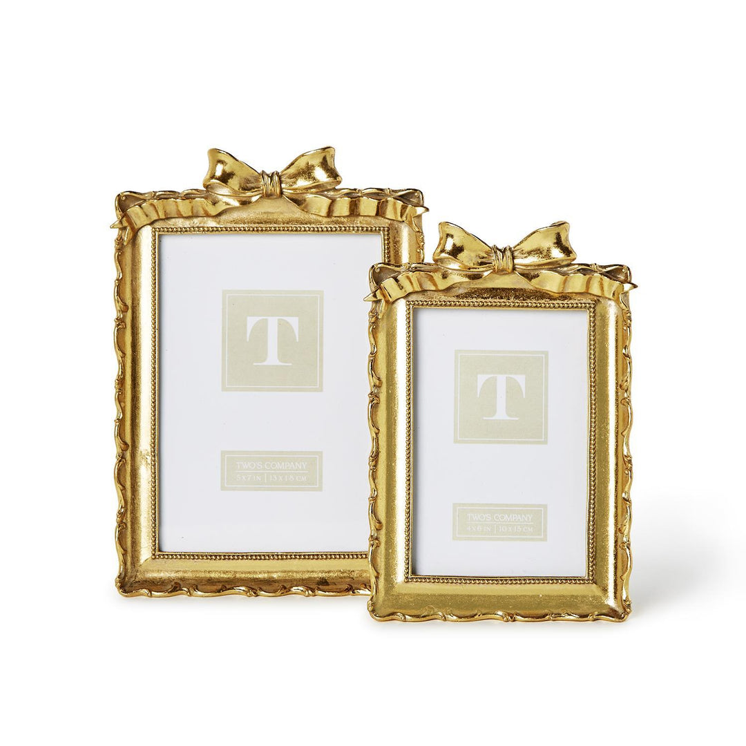 Set of 2 gold photo frames with bows, glossy finish, textured edges; includes one large and one small size.