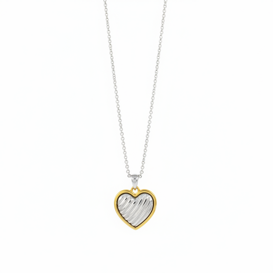 Gold-outlined heart pendant with textured silver center on fine chain; available in 16, 18, and 20-inch sizes.