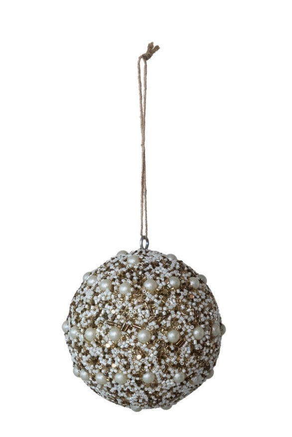 Ivory beaded ball ornament with cream-colored beads, gold sequins, and white pearls on a twine loop.