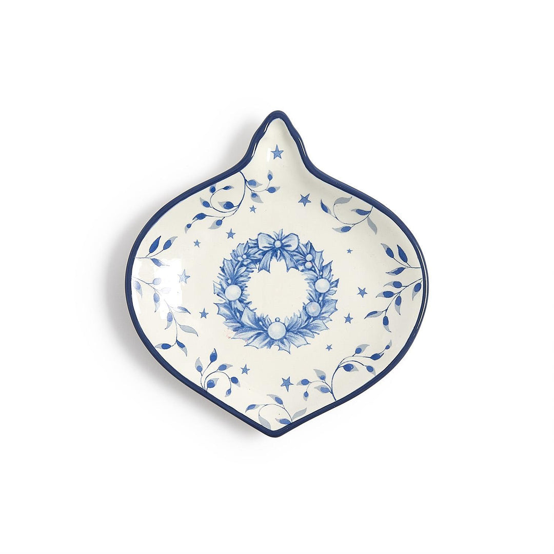 Season’s Gala ornament-shaped blue-and-white tidbit dish with wreath, leaf, and star pattern.