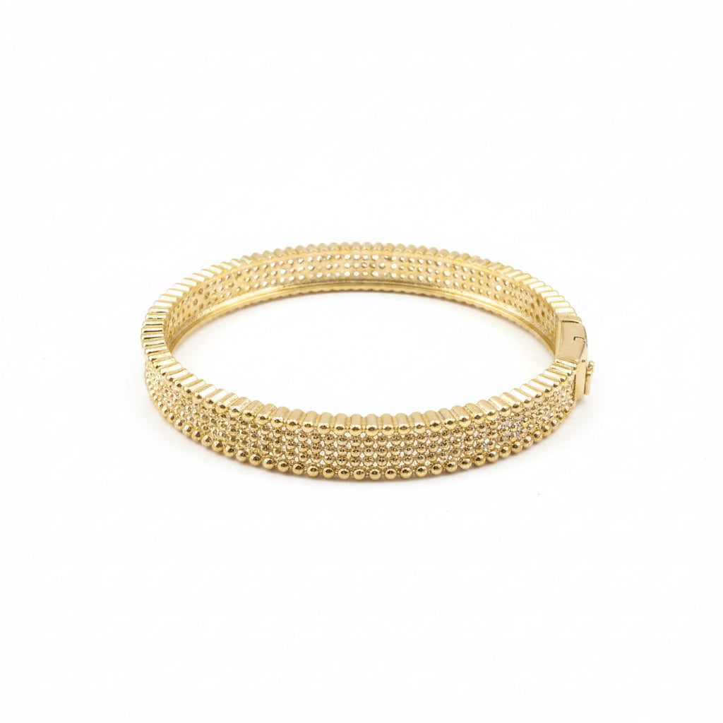 The Golden Hour Bangle: gold stacking bracelet with textured beaded design and clasp. Available in S, M, and L.