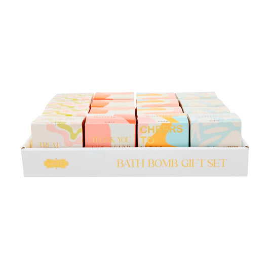 White tray labeled "Bath Bomb Gift Set" holds 12 pastel, scented bath bomb boxes with unique messages. Sizes: standard only.