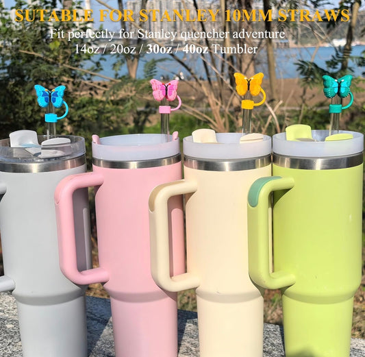 Set of four 3D butterfly straw covers in gray, pink, cream, and green. Compatible with Stanley tumblers. Sizes: small & large.