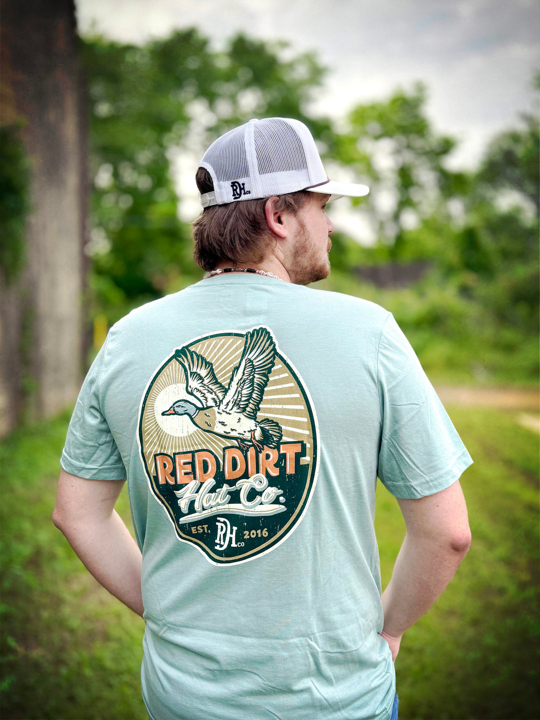 Light blue Big Duck Energy T-Shirt by Red Dirt Hat Company with flying duck design. Available in sizes S-XXL.