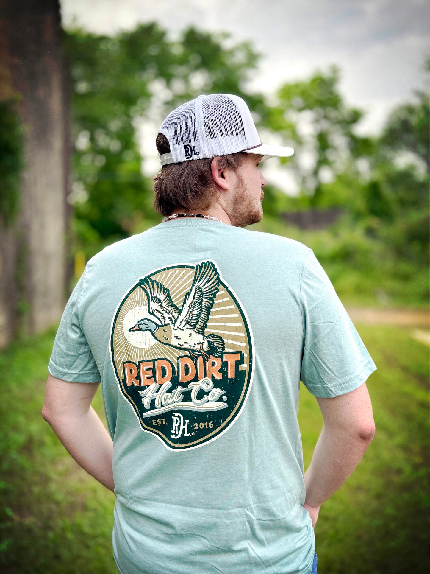 Light blue Big Duck Energy T-Shirt by Red Dirt Hat Company with flying duck design. Available in sizes S-XXL.