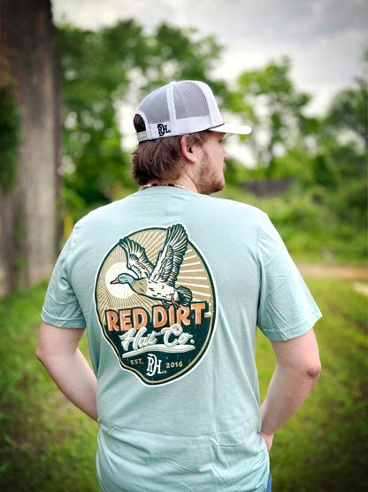 Light blue Big Duck Energy T-Shirt by Red Dirt Hat Company with flying duck design. Available in sizes S-XXL.