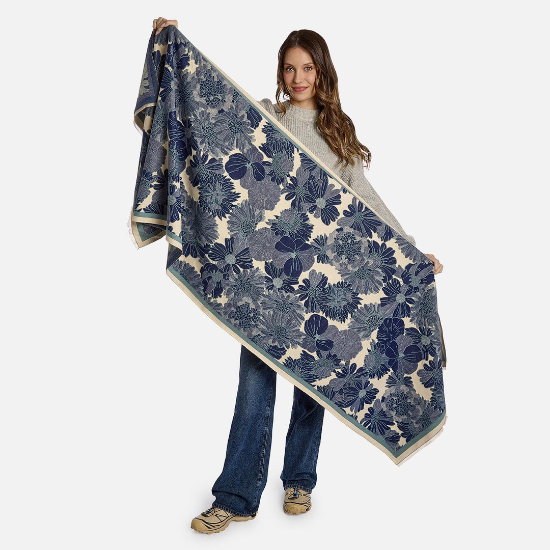 Rectangular blue floral scarf with white pattern and solid blue border.
