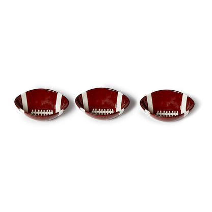 Set of three oval football-themed tidbit bowls with brown finish and white laces. Available in small, medium, and large sizes.