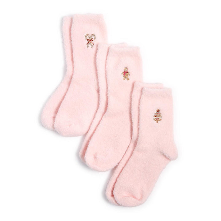 Three pairs of pink Cozy Holiday Socks with embroidered bow, gingerbread man, or Christmas tree icons. Available in various sizes.