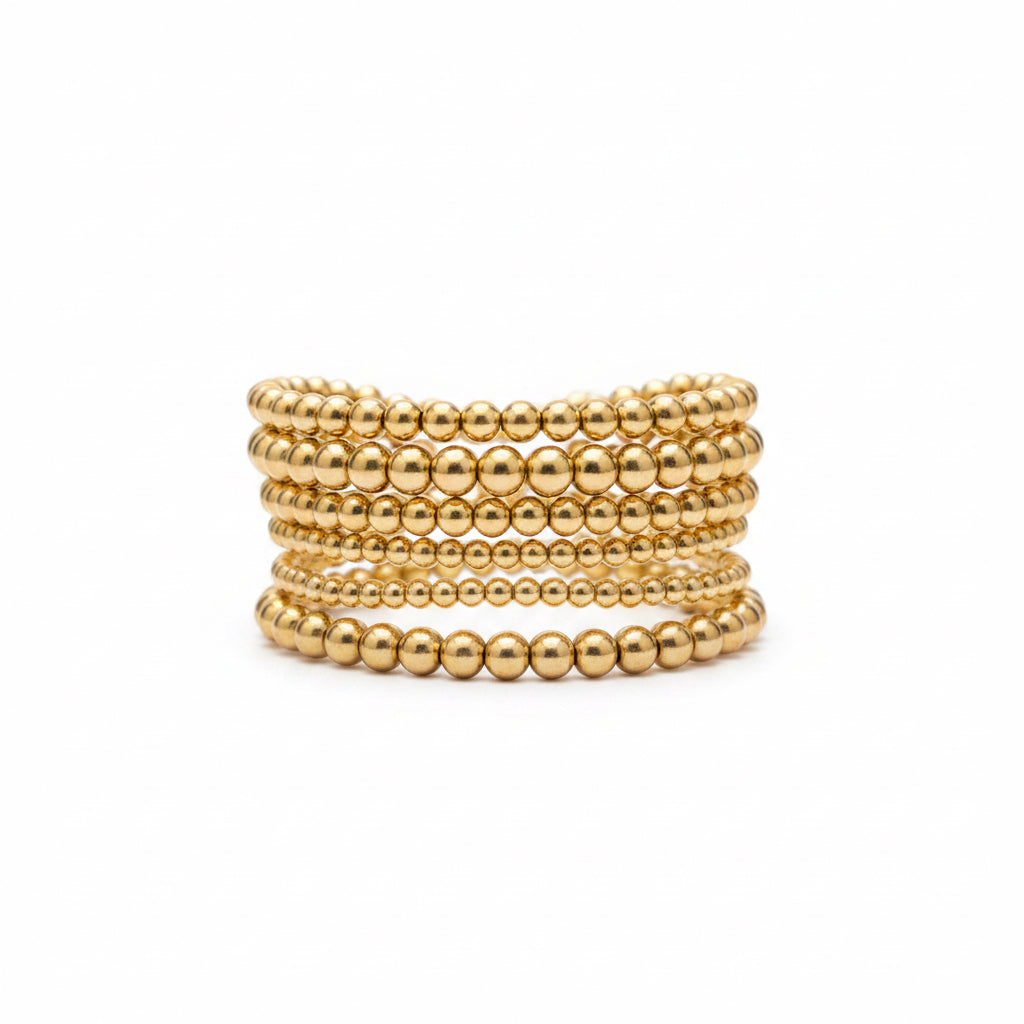 The Hunter 6-Strand Stretch Bracelet Stack features gold and silver designs and is available in multiple sizes.