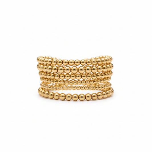 The Hunter 6-Strand Stretch Bracelet Stack features gold and silver designs and is available in multiple sizes.
