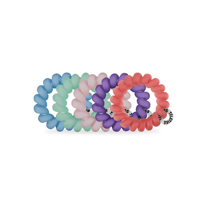 Set of four TELETIES Hair Ties in mint green, light pink, purple, and coral with a white tag. Available in small and large sizes.