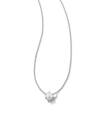 The Ashton Pearl Necklace by Kendra Scott has a thin silver chain and single round white pearl. Available in 16", 18", and 20" lengths.