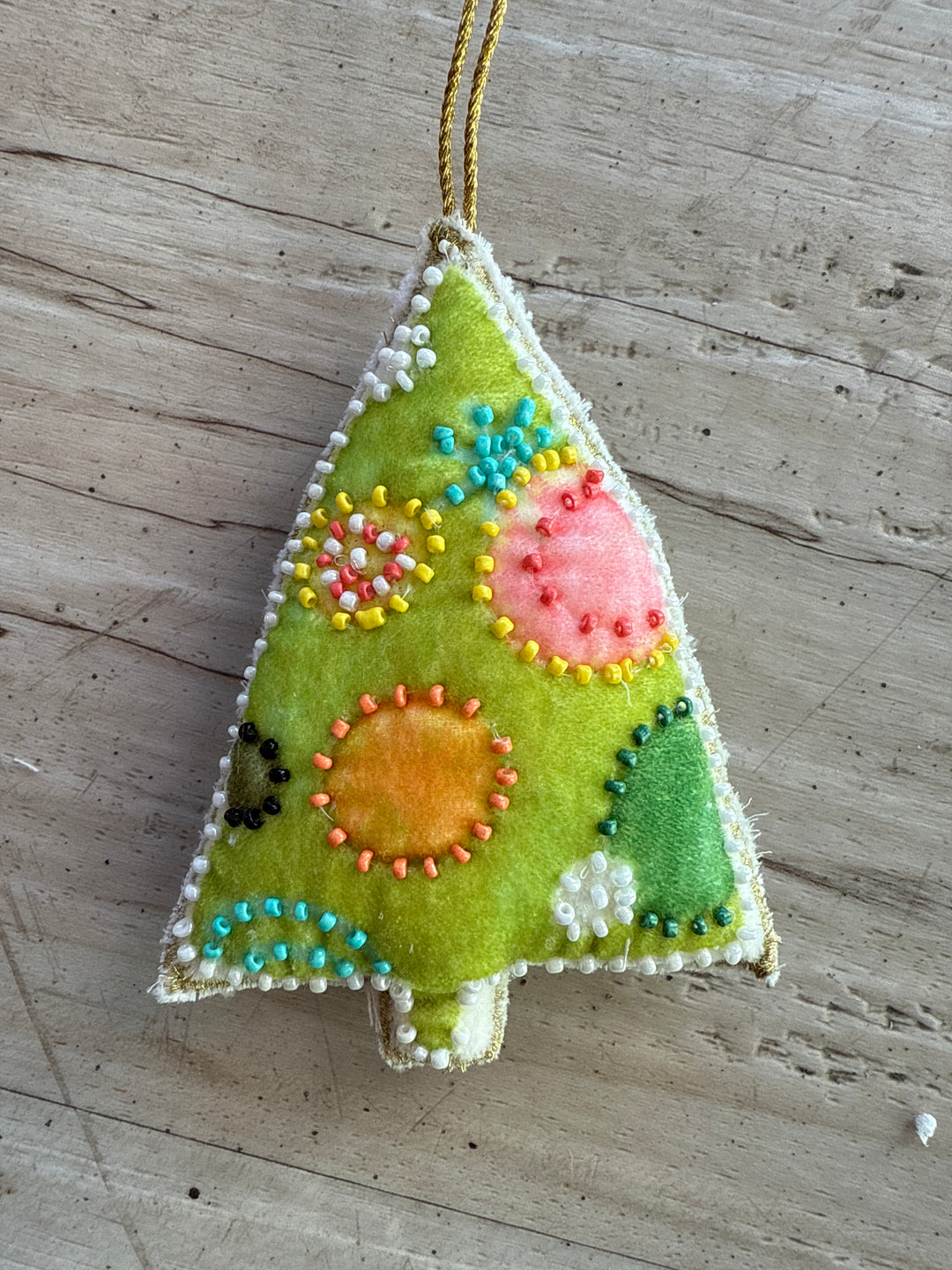 Lime green tree-shaped cotton velvet snowman ornament with embroidery and glass beads.