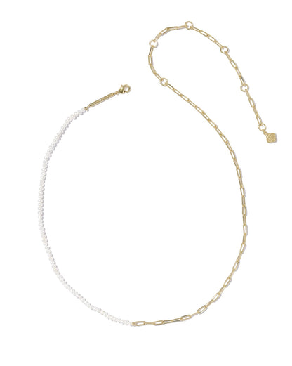 Gold necklace with one side of freshwater pearls, one side gold links, finished with small gold charm. Available in 16" and 18".